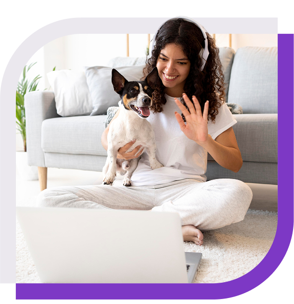 image of a woman and a dog waving at a laptop screen