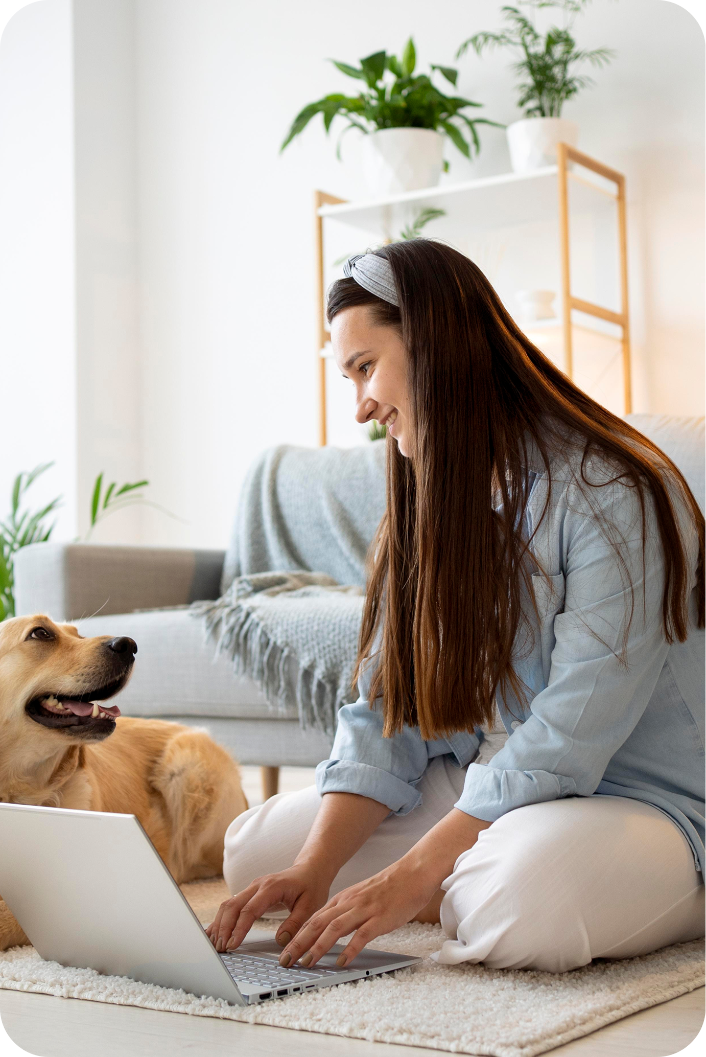 image of a woman sitting with a dog on the floor