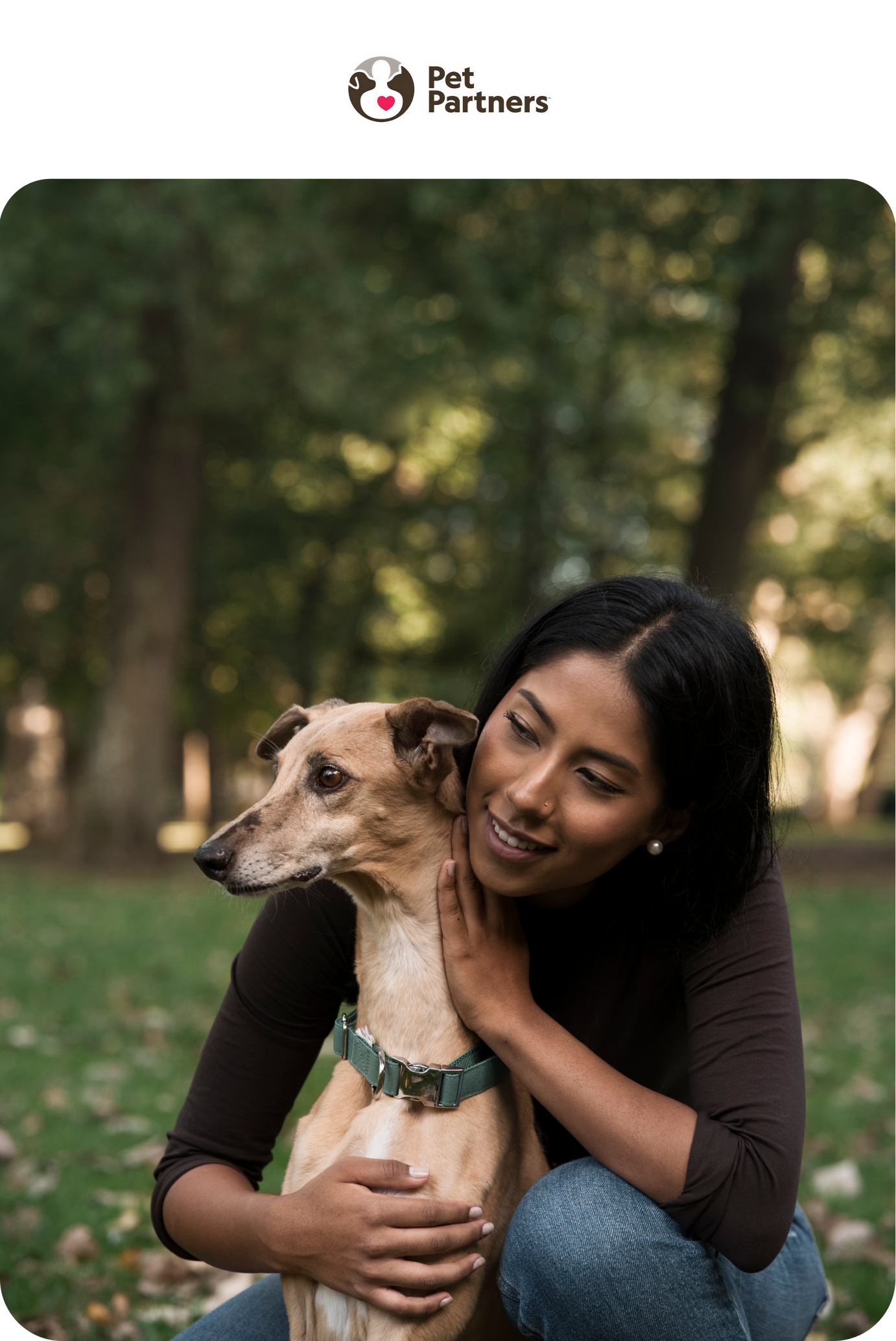 image of a woman sitting on the floor with her dog and a laptop