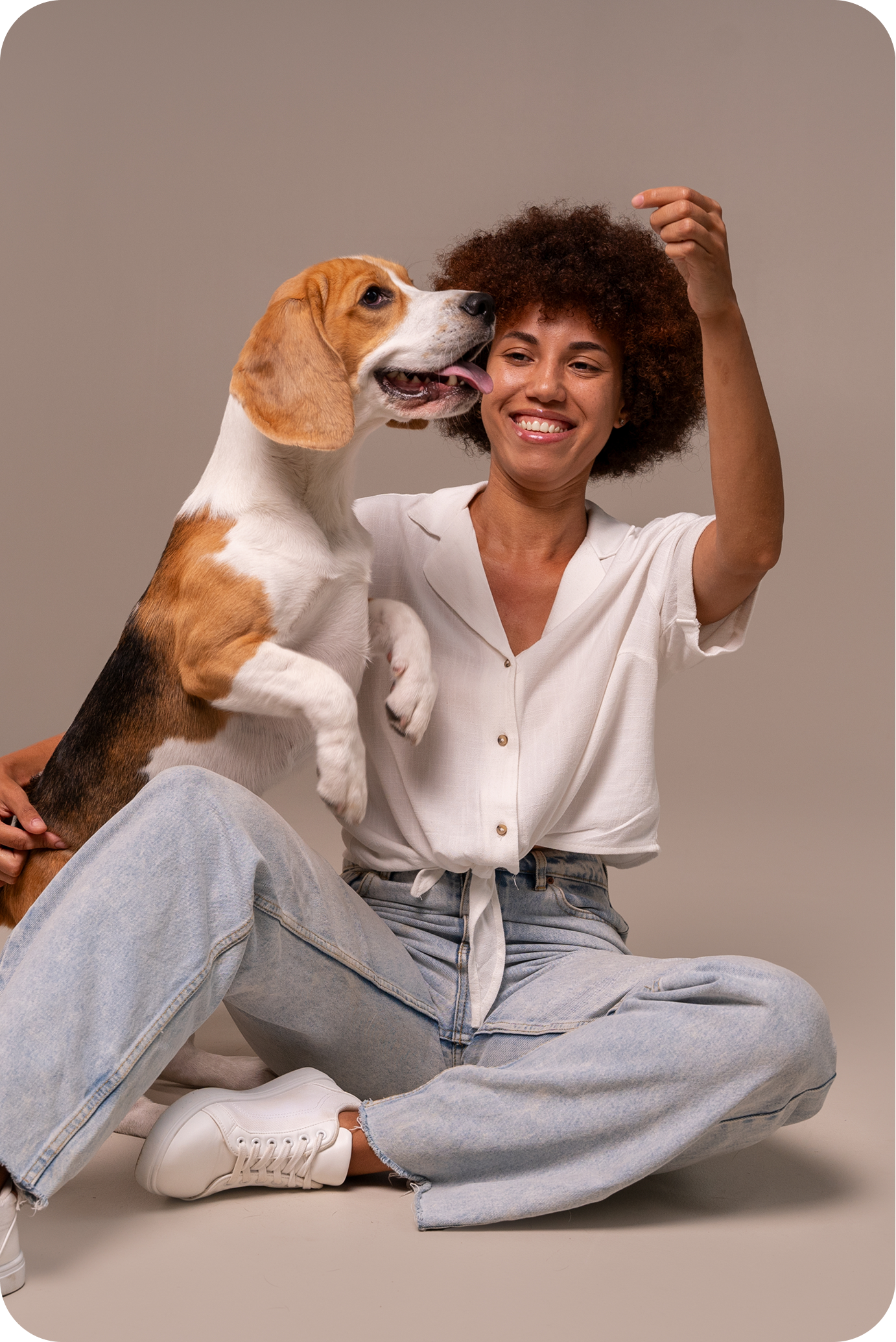 image of a woman playing with a dog