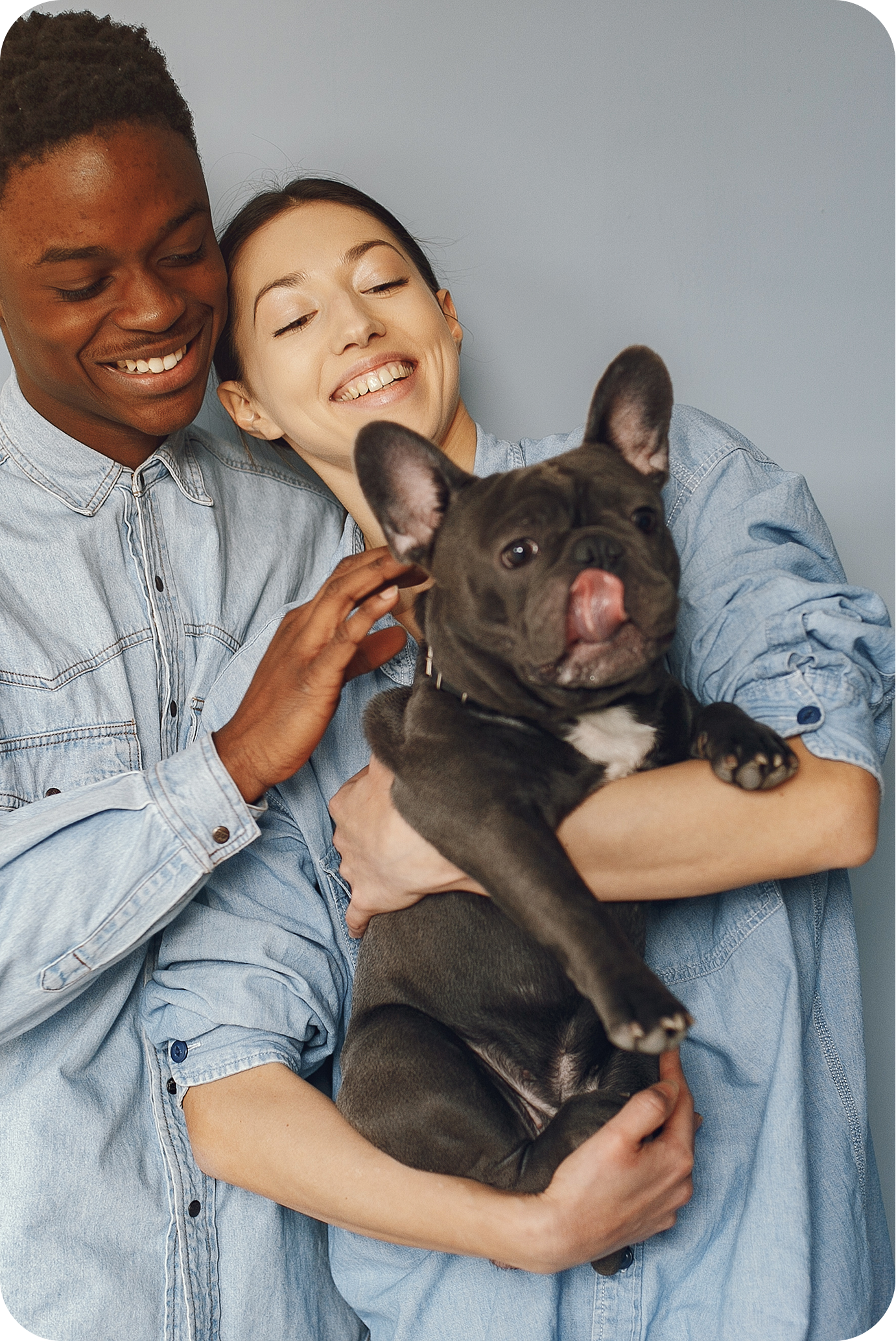 image of a happy couple holding a dog