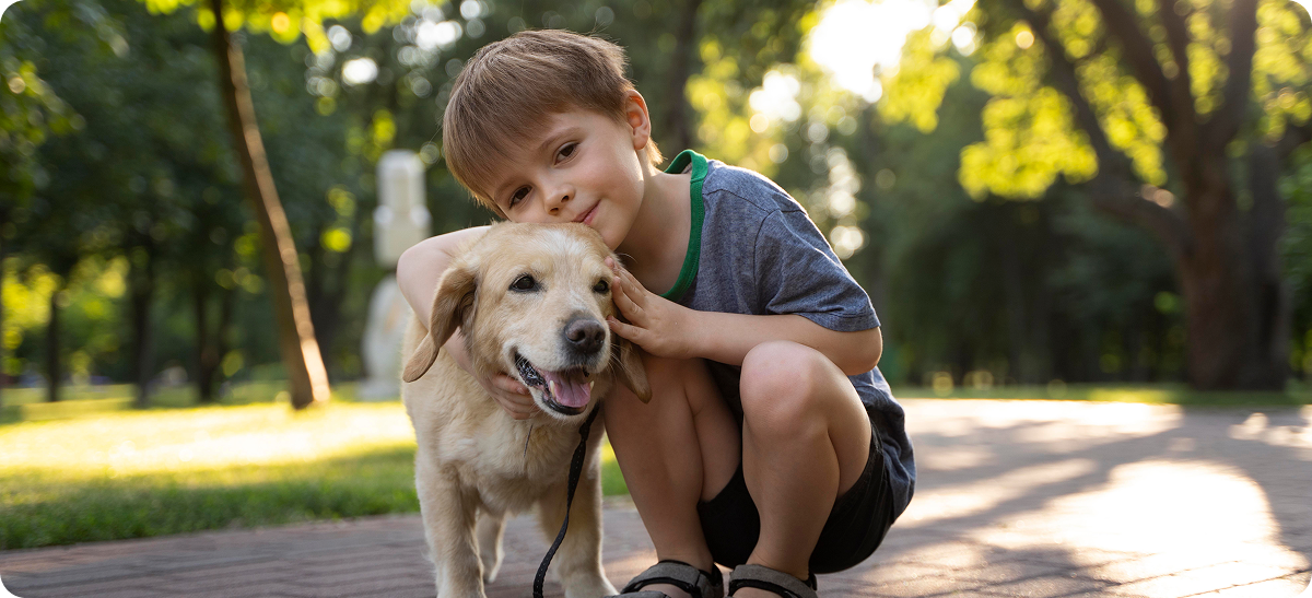 image of a kid petting a dog
