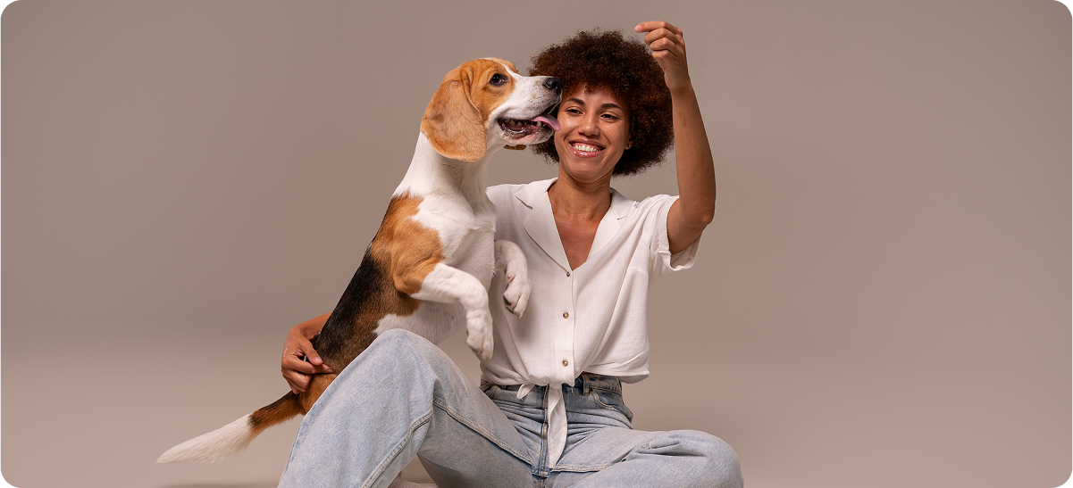 image of a woman playing with a dog
